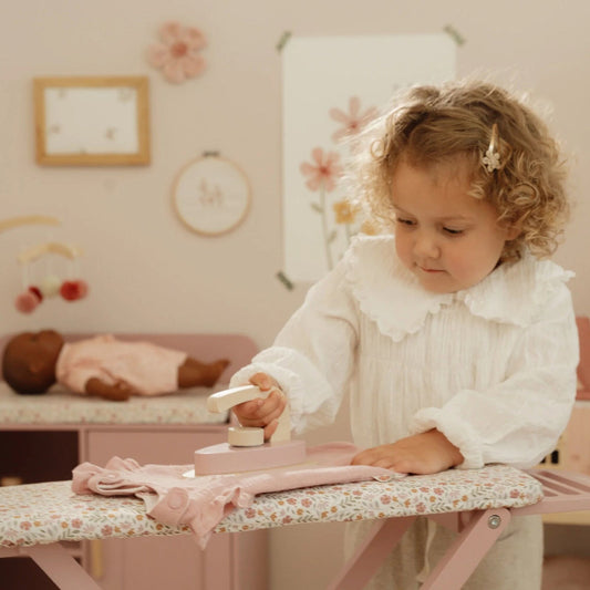 Wooden ironing board with iron