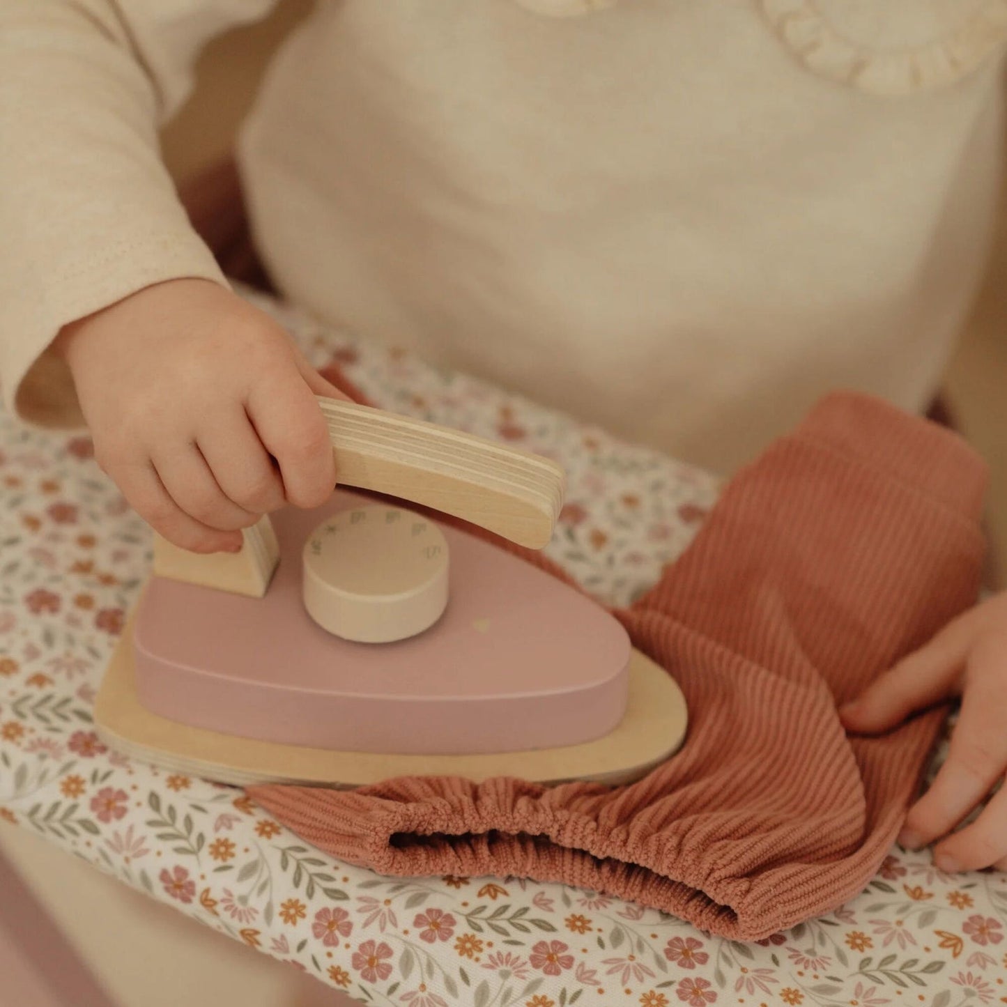 Wooden ironing board with iron
